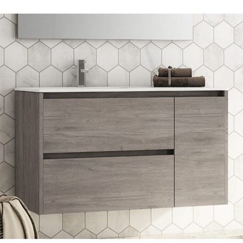 Mueble de lavabo frente a pared de azulejos